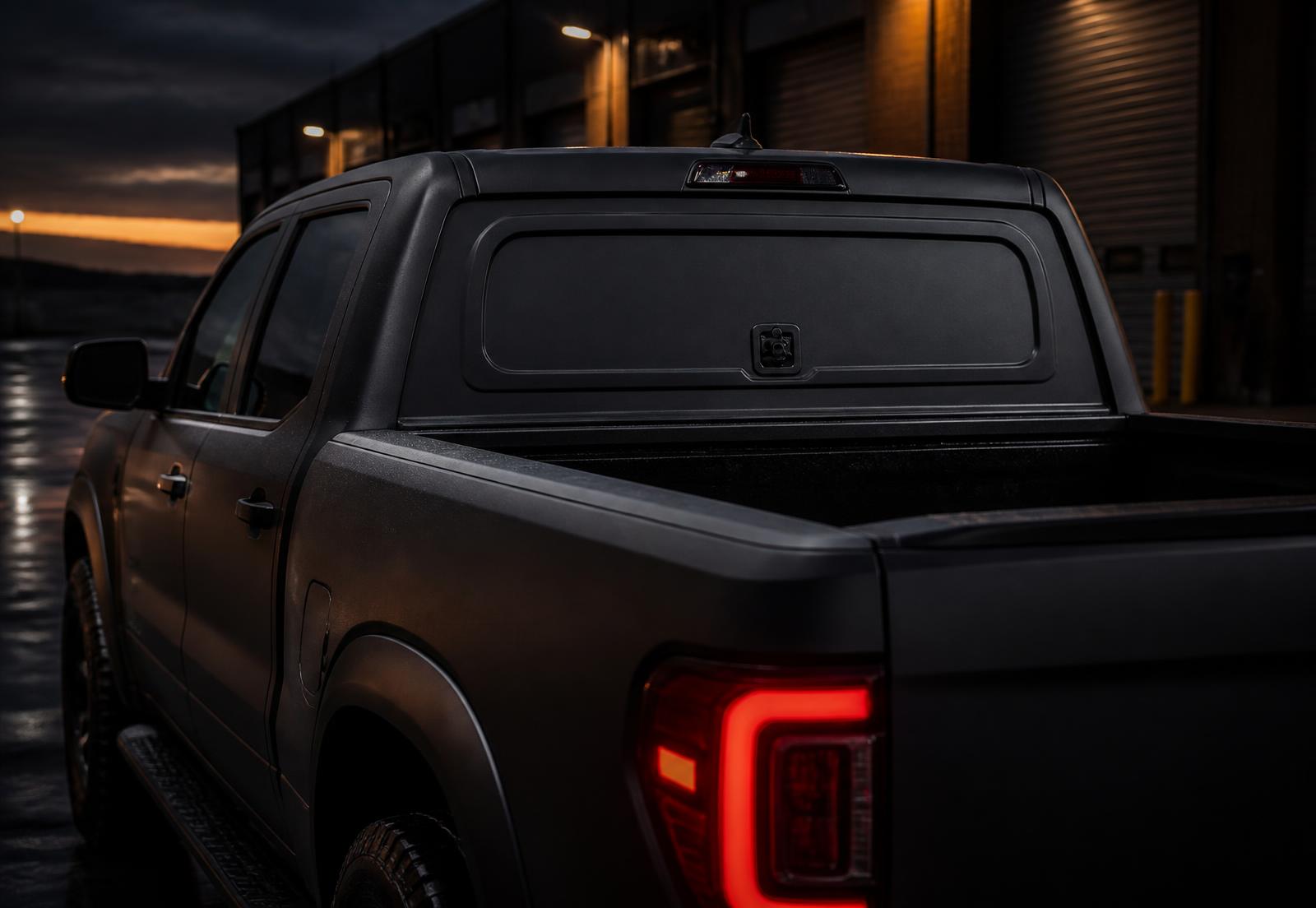 Matte charcoal pickup truck with a Wrap Or Not flip panel installed in the rear window